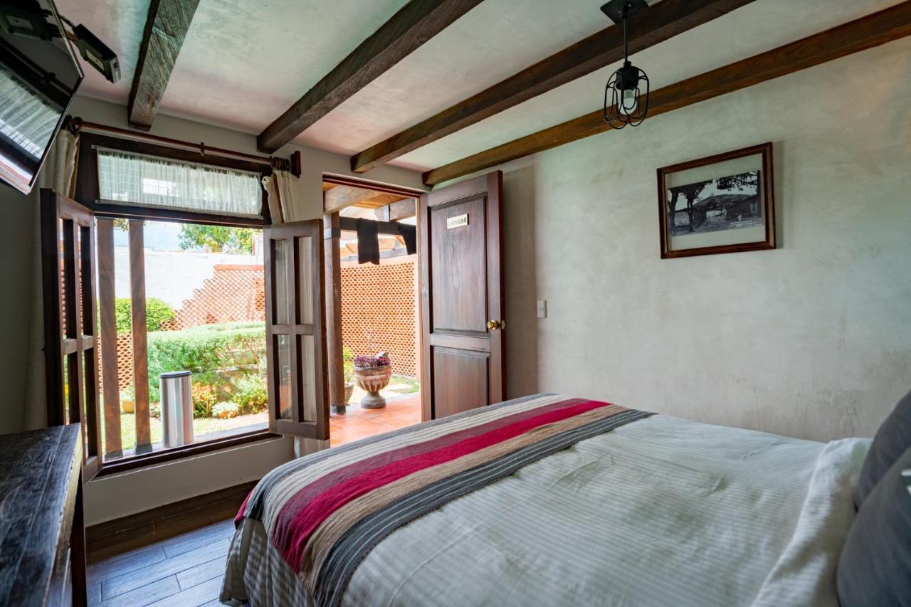 Yox Hotel Boutique San Cristobal de las Casas Exterior photo A bedroom at the hotel